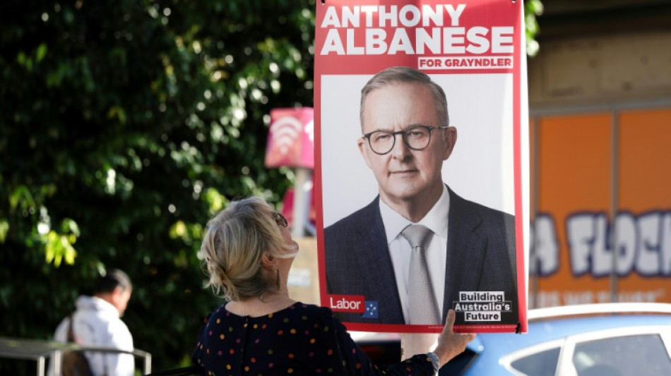 Australian PM says battle ahead to win election