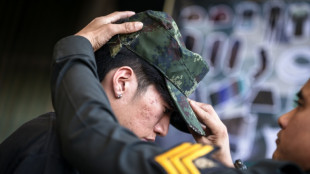 Red or black: Thai men tempt fate at military draft draw