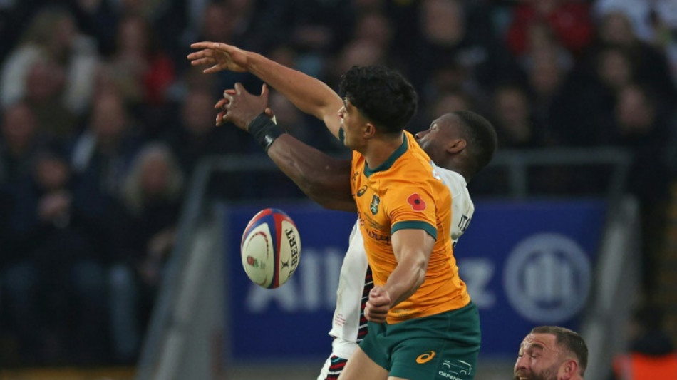 Schmidt elated by 'aerial freak' Suaalii as Australia edge England