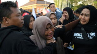 Indonesians pay tribute to victims of stadium crush one year on