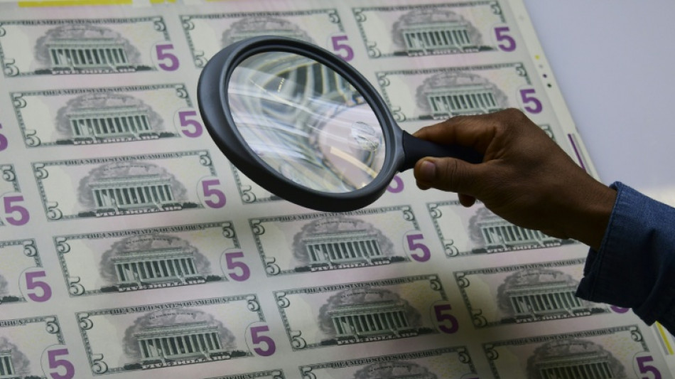 Stocks down with eyes on Mideast, dollar hit by Trump Fed comment