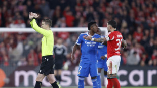 Vinicius stunner helps Real Madrid edge Benfica in play-off marred by alleged racism