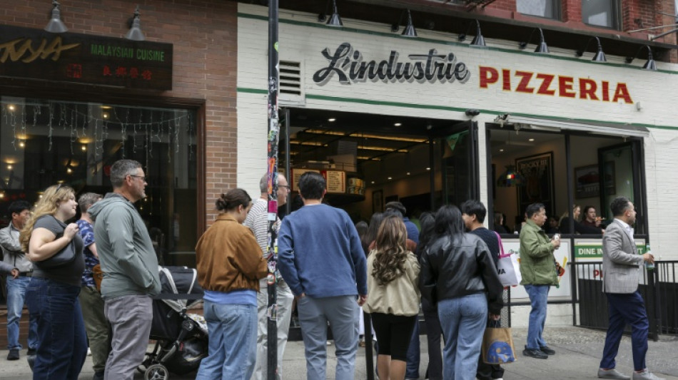 In New York, waiting in line becomes a social scene