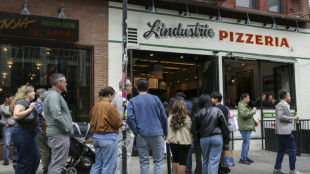 In New York, waiting in line becomes a social scene