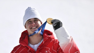 Swiss racer Von Allmen wins first gold of Winter Olympics
