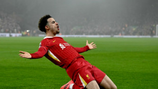 Leaders Liverpool survive Leicester scare to go seven points clear