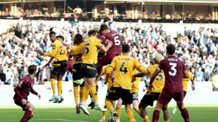 Stones bags controversial winner as Man City survive Wolves scare