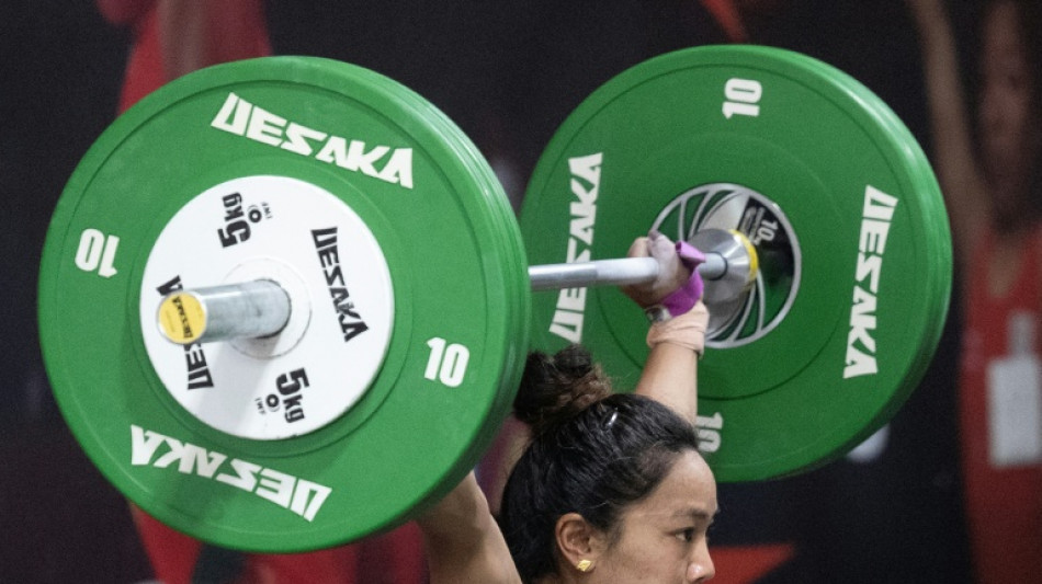 India trailblazer won't 'let go' of chance for Asian weightlifting glory